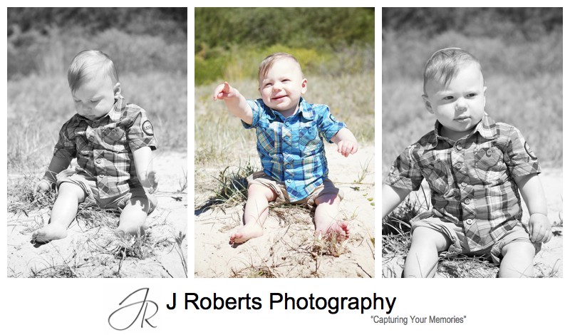 toddler sitting in sand dunes at the beach - sydney family portrait photographer